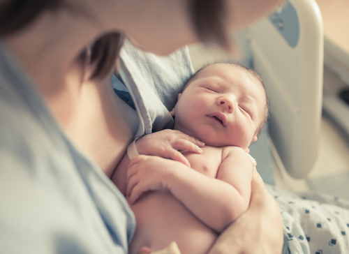 New,Born,Baby,Boy,Resting,In,Mothers,Arms. New,Born,Baby,Boy,Resting,In,Mothers,Arms.