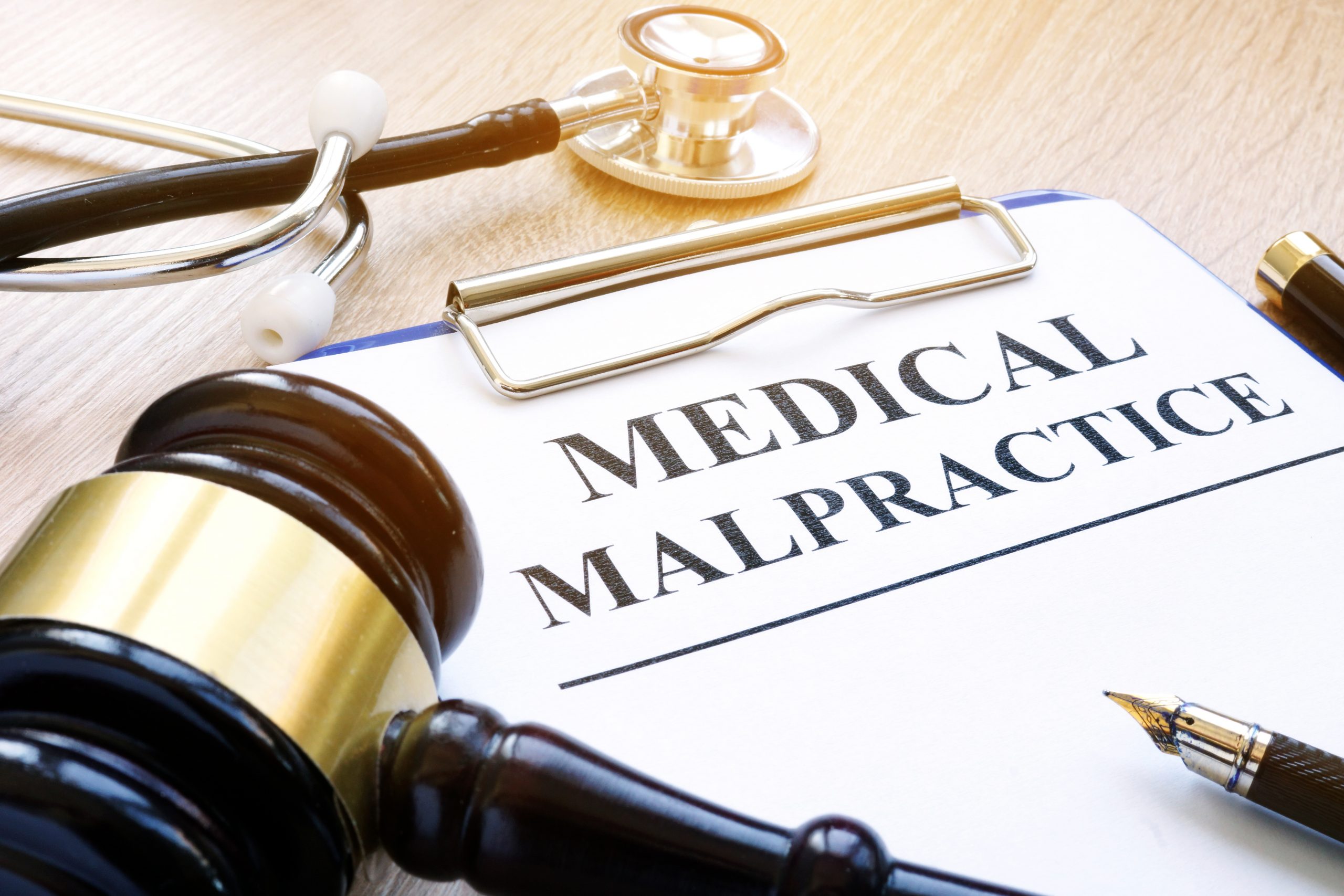 Clipboard with documents about medical malpractice and gavel. Washington DC Medical Malpractice Attorney